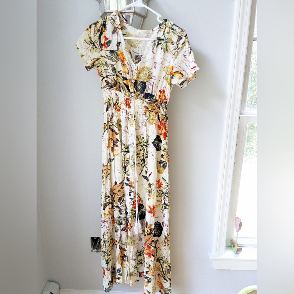 Floral maxi dress. Tie and buttons in front. Size Small. Cinched waist.